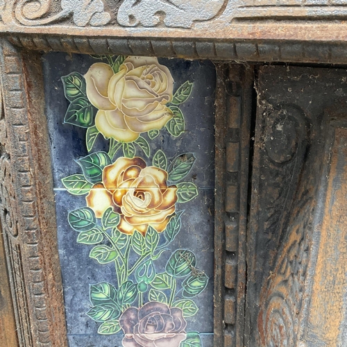 1747 - A Victorian cast iron and Ducal tile fire surround. 96cm x 94.5cm