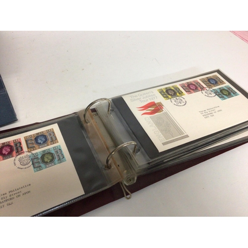 2013 - A collection of first day covers displayed in albums