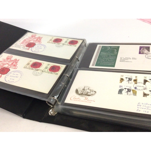 2013 - A collection of first day covers displayed in albums