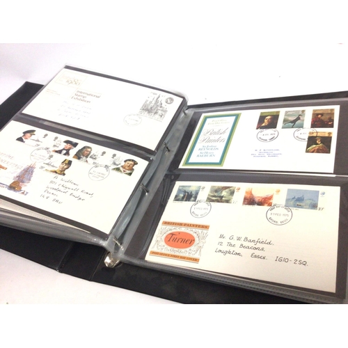 2013 - A collection of first day covers displayed in albums