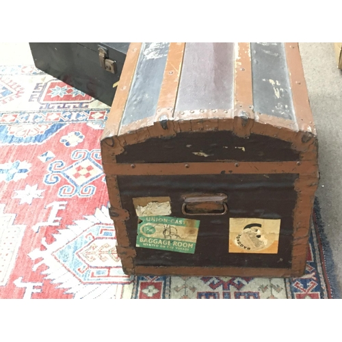 2430 - Dome top trunk with various vintage travel stickers and other box . Postage cat D