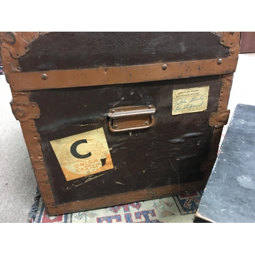 2430 - Dome top trunk with various vintage travel stickers and other box . Postage cat D