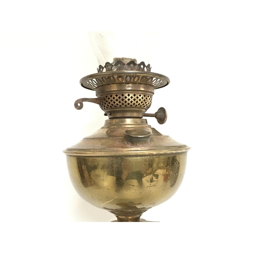 816 - Victorian brass oil lamp with brass reservoir and funnel , approximately 72cm tall