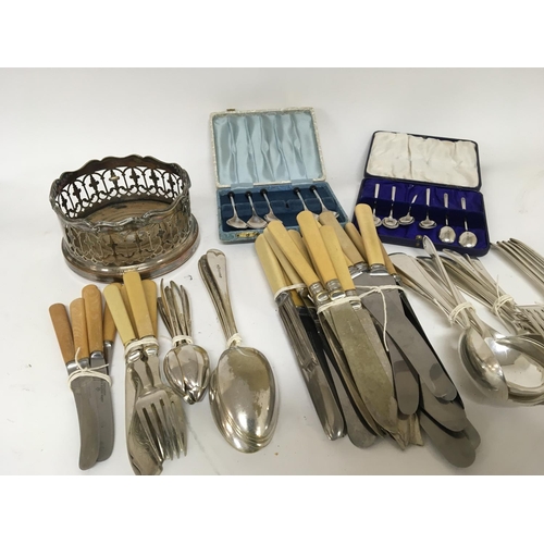 834 - A collection of silver plated cutlery a cased set of silver coffee spoons and a silver plated wine c... 