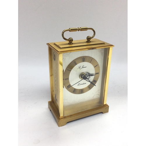 835 - A brass cased carriage clock, St James of London. Shipping category D.