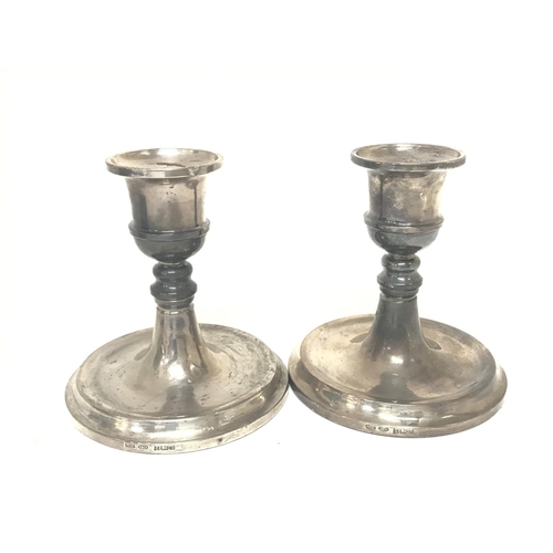 848 - A pair of Birmingham silver Hallmarked loaded base candle sticks.