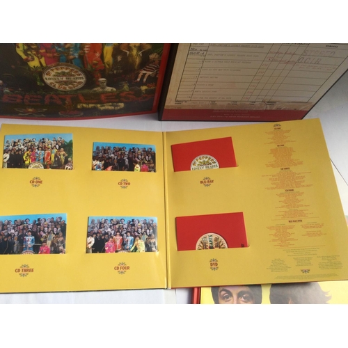 113 - A Beatles 'Sgt Peppers' super deluxe 6 disc box set with lenticular sleeve, book and all inserts.