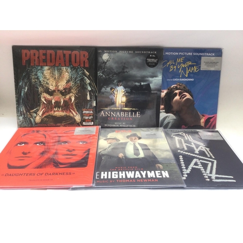 127 - A collection in two bags of thirteen 180g coloured vinyl film soundtrack LPs including Predator, Dun... 