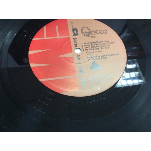 165 - Two Queen LP including a first UK pressing. Vinyl Ex.