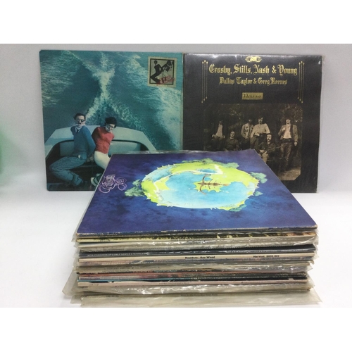 208 - A collection in two bags of LPs from the 1960s and 70s including John Lennon, Sparks, Jethro Tull an... 