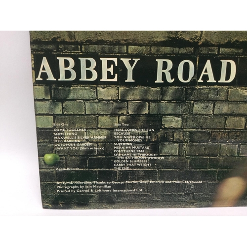 211 - A collection of Beatles LPs, EPs and 7inch including a first UK pressing of 'Abbey Road', 'Magical M... 