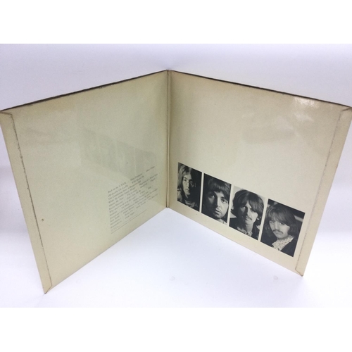 28 - A numbered Beatles 'White Album', no. 0332445, top loading and complete with black inner sleeves, fo... 