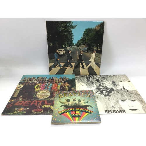 284 - Three early UK pressings of Beatles LPs comprising 'Revolver', 'Sgt Pepper' and 'Abbey Road' plus a ... 