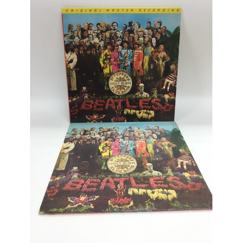 29 - Two different pressings of The Beatles LP 'Sgt Pepper's Lonely Hearts Club Band' comprising a rare y... 