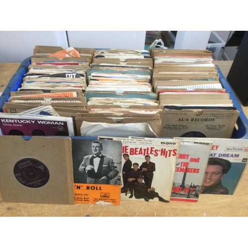 323 - A collection of 7inch singles and EPs by artists from the 1950s and onwards including The Beatles, L... 