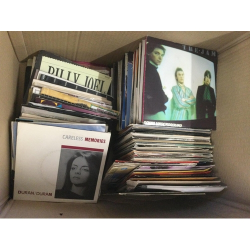 362 - A box containing a collection of mainly 1970s and 80s 7inch singles by various artists including The... 