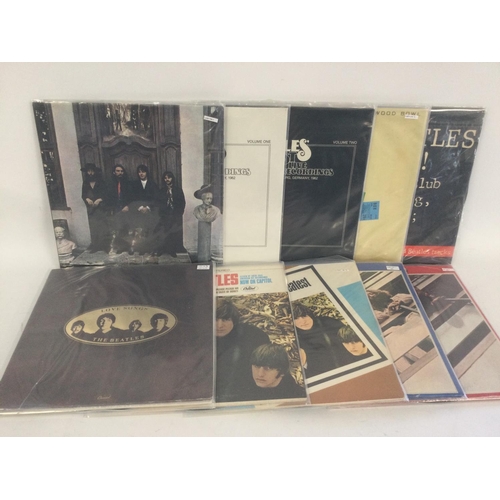 402 - A collection in two bags of Beatles and related mainly compilation LPs including 'Love Songs', 'Past... 