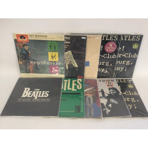 402 - A collection in two bags of Beatles and related mainly compilation LPs including 'Love Songs', 'Past... 