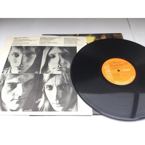 42 - Three David Bowie LPs comprising a first UK pressing of 'Ziggy Stardust', NM, a rare German issued L... 