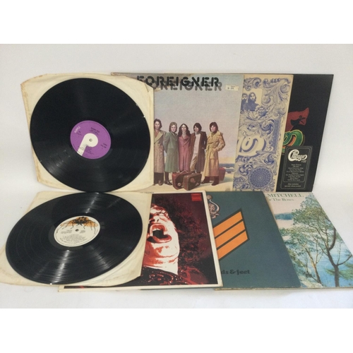 428 - A collection in two bags of eighteen rock and pop LPs by various artists including Deep Purple, Joe ... 