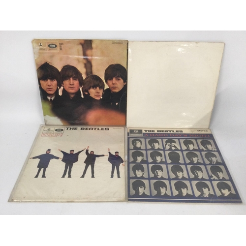 464 - Four Beatles LPs comprising 'The White Album', 'Beatles For Sale', 'A Hard Day's Night' and 'Help!'.