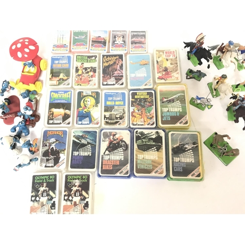 129 - A Box Containing Vintage Top Trumps. Smurfs and Britains.No Reserve.