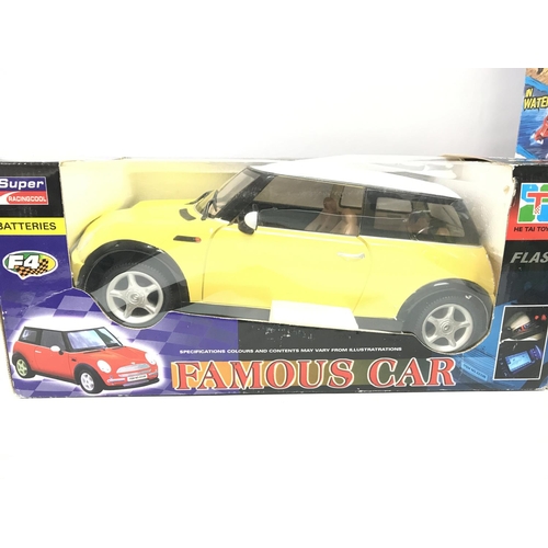 228 - A Boxed Tyco R/C Terrain Twister and a He Tai Toys R/C Mini.(2).