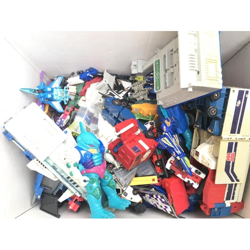 252 - A Box Containing Playworn Transformers etc.
