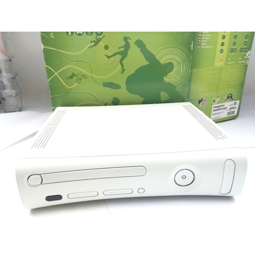 257 - A Boxed X Box 360 With A Collection of Games and accessories including Lego Dimensions and Skylander... 