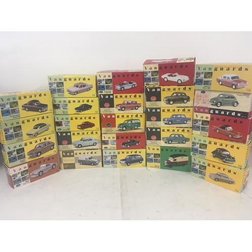 842 - A collection of 24 boxed model cars by Vanguards. Scale 1..43