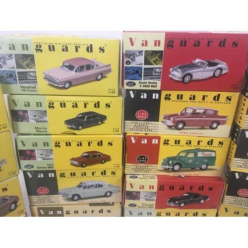 842 - A collection of 24 boxed model cars by Vanguards. Scale 1..43