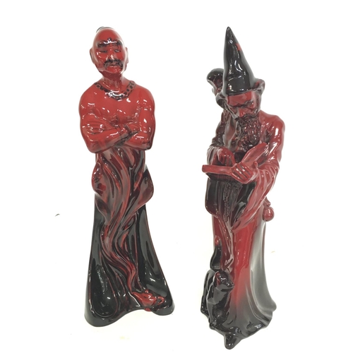 1008 - A pair of Royal Doulton porcelain Flambe figurines including The Genie HN 2999 & The Wizard HN 3121.... 