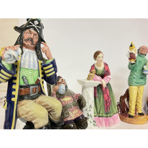 1010 - A collection of Royal Doulton figures including The Pirate King HN 2901, Mendieant HN 1365, The Foam... 