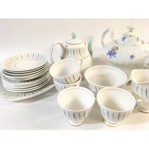 1015 - A collection of part tea sets including Queen Anne with caprice design. Postage D