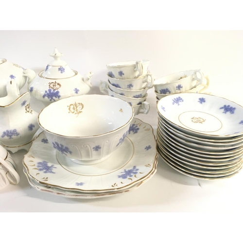 1015 - A collection of part tea sets including Queen Anne with caprice design. Postage D