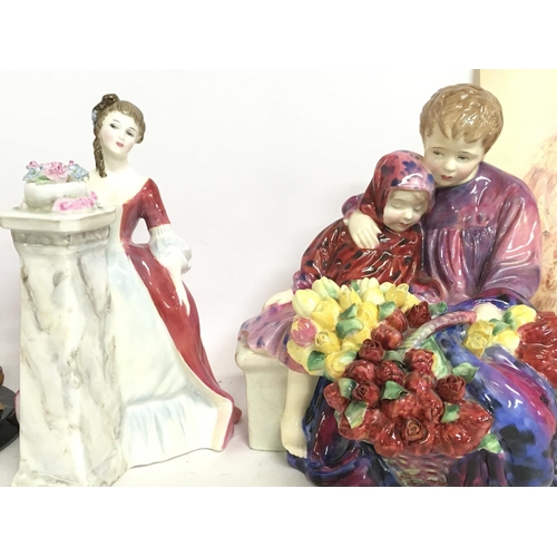 1021 - A collection of Royal Doulton porcelain figures including Red Red Rose HN 3994, Spring HN 2085, Flow... 