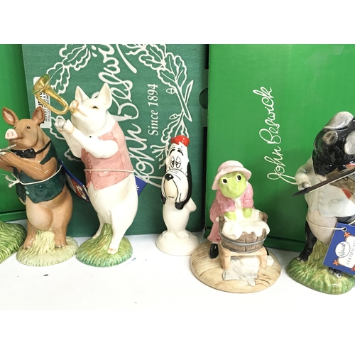 1023 - A collection of boxed John Beswick porcelain figures including Sage the Owl, Washerwoman Toad, Droop... 