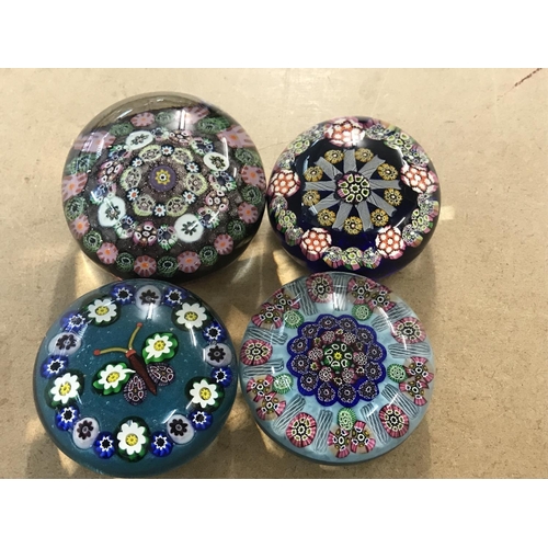 1038 - A Collection of four Ysart style MilleFiori paper weights .