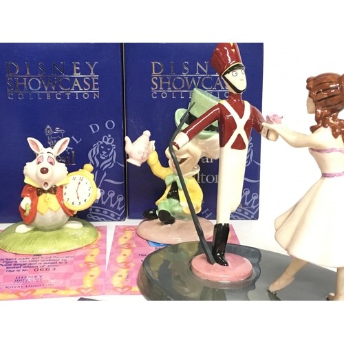 1039 - A collection of boxed Royal Doulton Disney Showcase collection figures with COAS including Alice In ... 