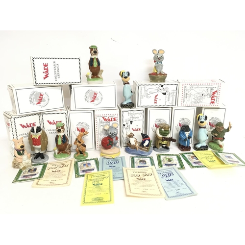 1042 - A collection of boxed Wade ceramic figures including Yogi Bear, Huckleberry Hound, Boo Boo, Pixie & ... 