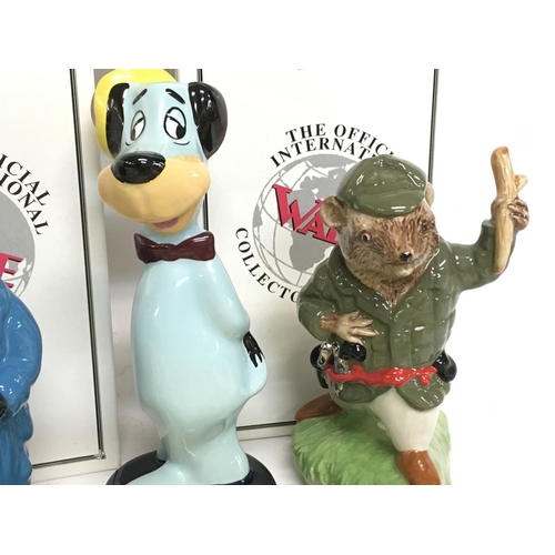 1042 - A collection of boxed Wade ceramic figures including Yogi Bear, Huckleberry Hound, Boo Boo, Pixie & ... 