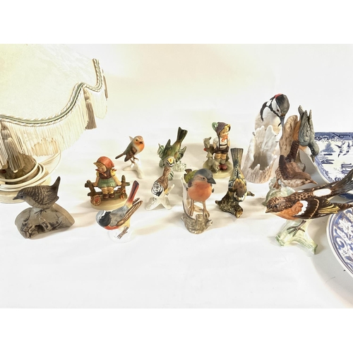 1045 - Collective lot of ceramics including Goebel figures a lamp which shows signs of extensive repair and... 