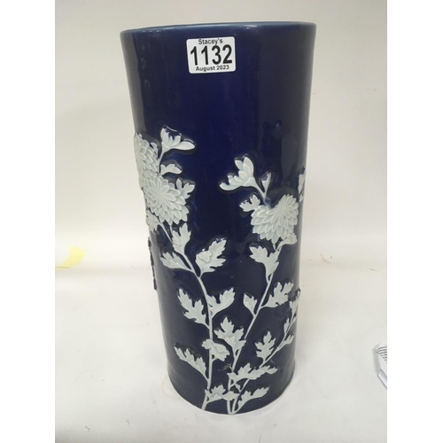 1105 - An Early 20th century oriental stick stand with raised flowers and foliage on a deep blue ground. He... 