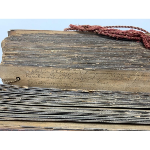 1113 - An Early 20thC palm leaf scripture with wooden covers, written in Tamil, Possibly Sri Lankan origin.... 