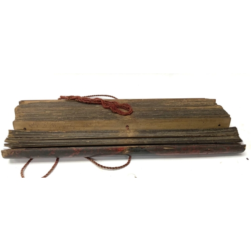 1113 - An Early 20thC palm leaf scripture with wooden covers, written in Tamil, Possibly Sri Lankan origin.... 