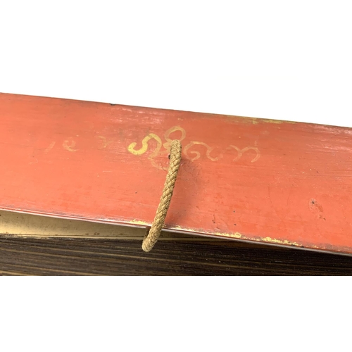 1114 - An Early 20thC palm leaf scripture with lacquered wooden covers, written in Tamil, Possibly Sri Lank... 