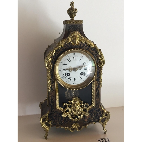 1255 - A French Boulle work clock with a white enamel dial the movement striking on a bell. Height 38cm