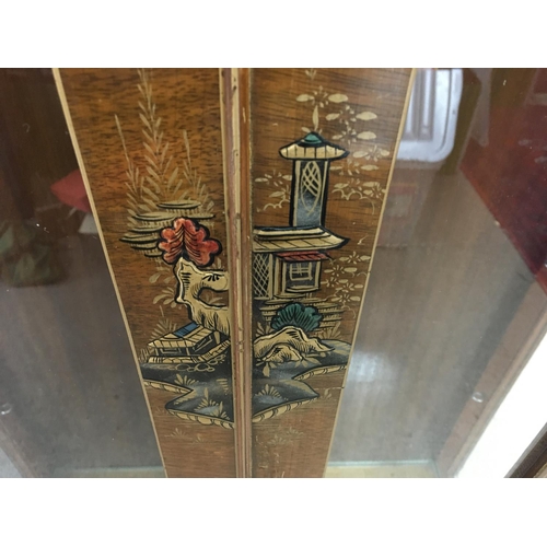 1264 - A lacquer cabinet featuring oriental style artwork. 71w x 125h and 28cm deep. Postage D