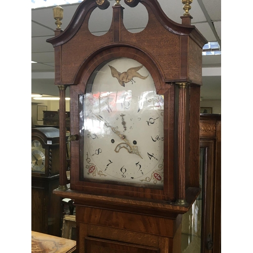 1275 - An inlaid oak and mahogany cross banded longcase clock eight day going with a white dial.