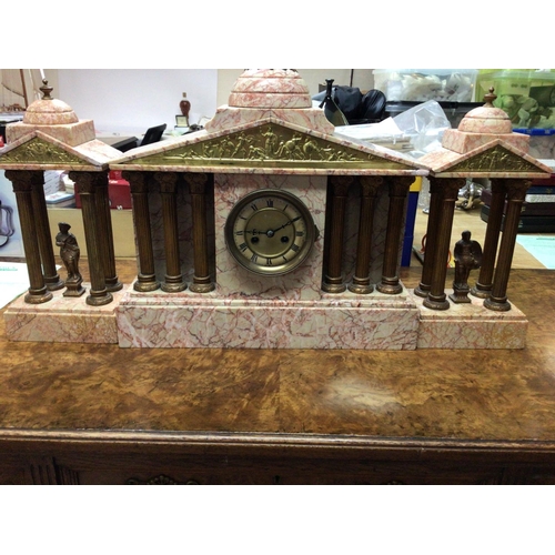 1306 - A Victorian pink marble clock set of classical form the dial with Roman numerals .